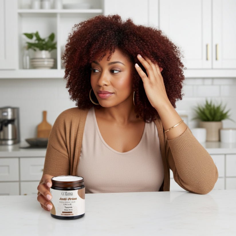 Woman with curly hair holding a jar of QViana Anti-Frizz Nourishing Cream in a modern kitchen